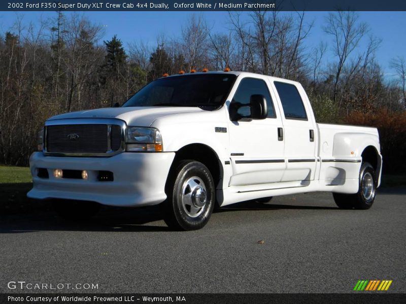 Front 3/4 View of 2002 F350 Super Duty XLT Crew Cab 4x4 Dually