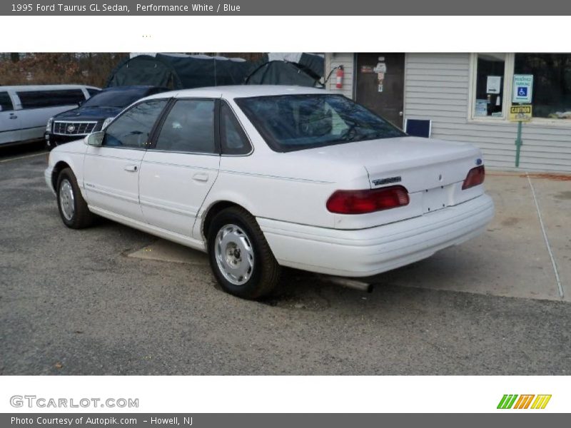 Performance White / Blue 1995 Ford Taurus GL Sedan