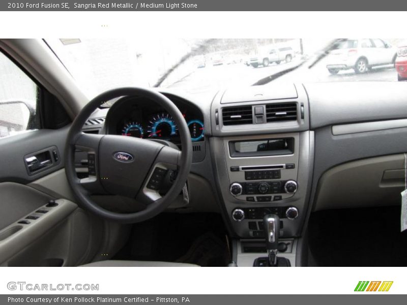 Sangria Red Metallic / Medium Light Stone 2010 Ford Fusion SE