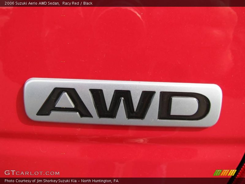 Racy Red / Black 2006 Suzuki Aerio AWD Sedan