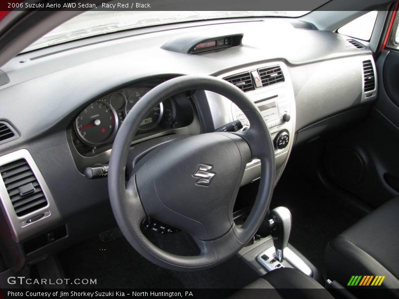 Racy Red / Black 2006 Suzuki Aerio AWD Sedan