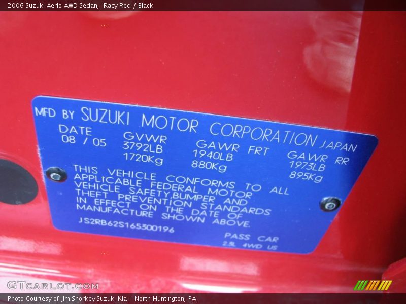 Racy Red / Black 2006 Suzuki Aerio AWD Sedan
