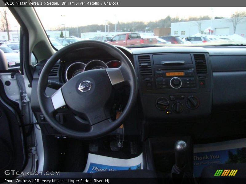 Brilliant Silver Metallic / Charcoal 2010 Nissan Versa 1.6 Sedan