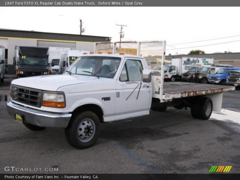 Front 3/4 View of 1997 F350 XL Regular Cab Dually Stake Truck
