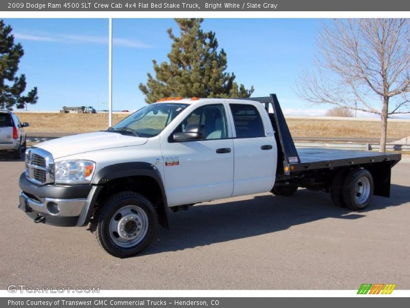 Front 3/4 View of 2009 Ram 4500 SLT Crew Cab 4x4 Flat Bed Stake Truck