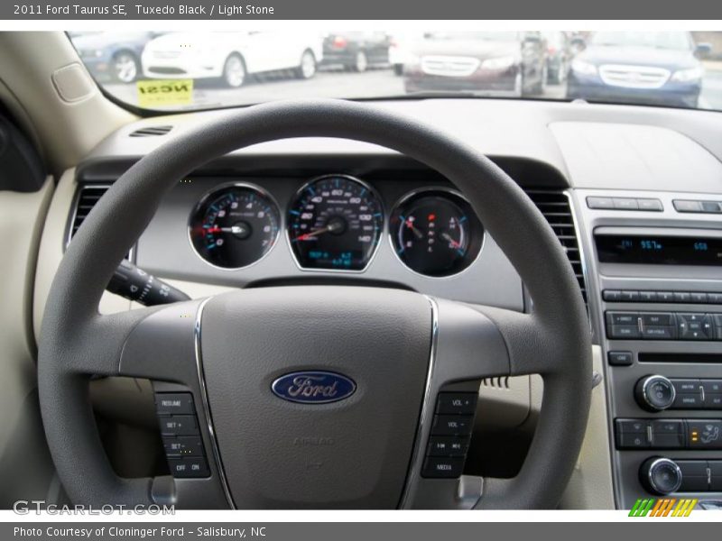 Tuxedo Black / Light Stone 2011 Ford Taurus SE