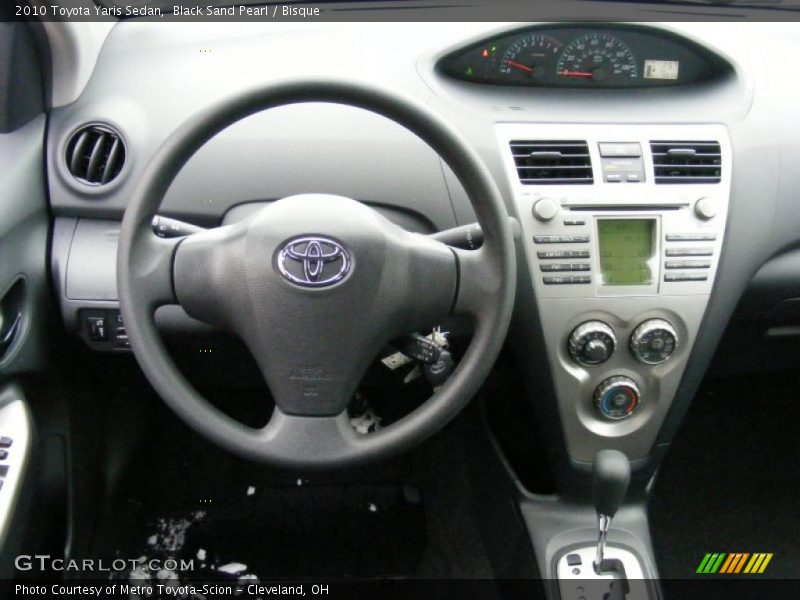 Black Sand Pearl / Bisque 2010 Toyota Yaris Sedan