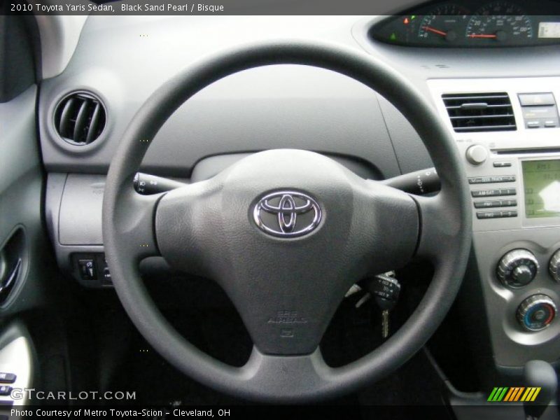 Black Sand Pearl / Bisque 2010 Toyota Yaris Sedan