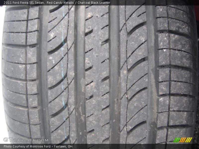 Red Candy Metallic / Charcoal Black Leather 2011 Ford Fiesta SEL Sedan
