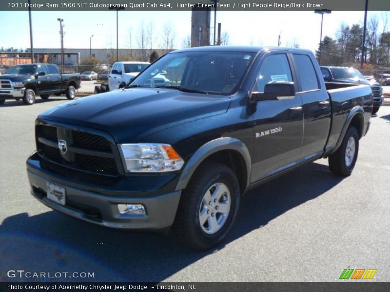 Front 3/4 View of 2011 Ram 1500 SLT Outdoorsman Quad Cab 4x4