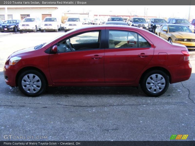 Barcelona Red Metallic / Bisque 2010 Toyota Yaris Sedan