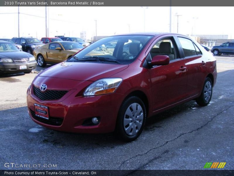 Barcelona Red Metallic / Bisque 2010 Toyota Yaris Sedan