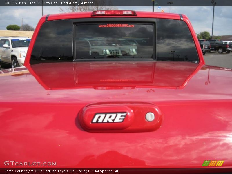 Red Alert / Almond 2010 Nissan Titan LE Crew Cab