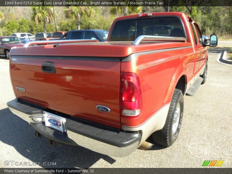 Bright Amber Metallic / Medium Prairie Tan 1999 Ford F250 Super Duty Lariat Extended Cab