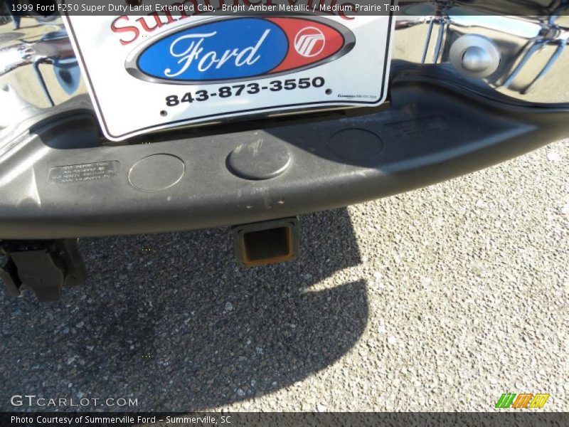 Bright Amber Metallic / Medium Prairie Tan 1999 Ford F250 Super Duty Lariat Extended Cab