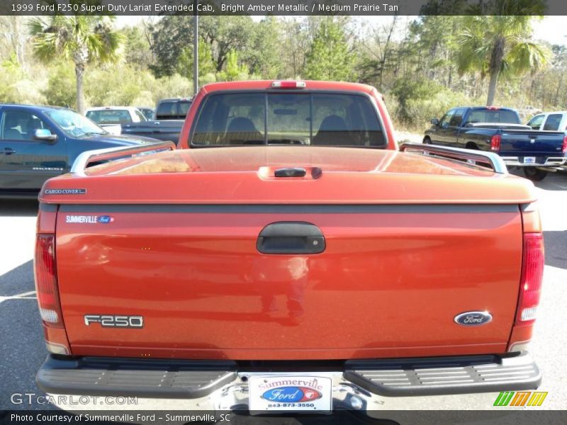 Bright Amber Metallic / Medium Prairie Tan 1999 Ford F250 Super Duty Lariat Extended Cab