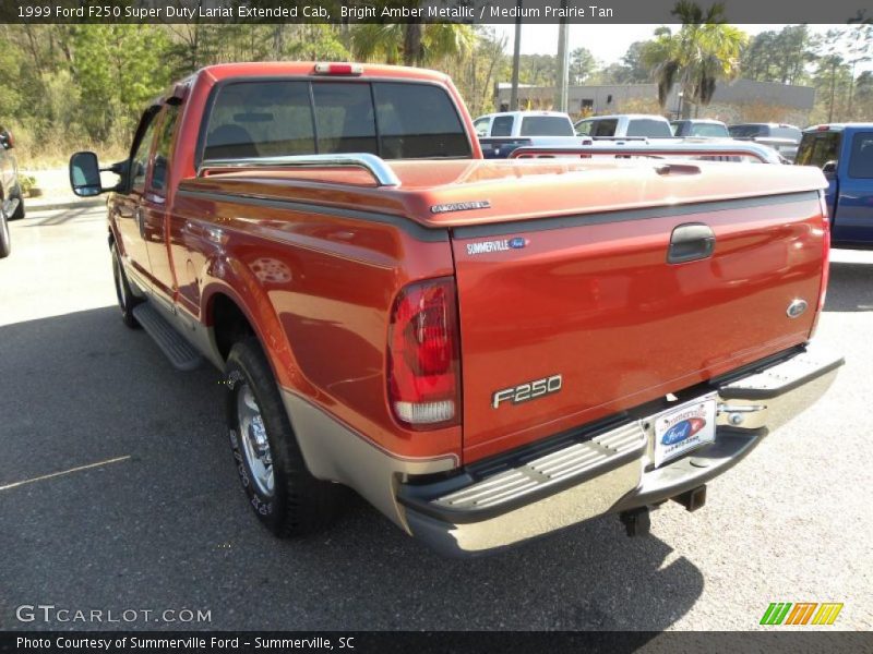 Bright Amber Metallic / Medium Prairie Tan 1999 Ford F250 Super Duty Lariat Extended Cab