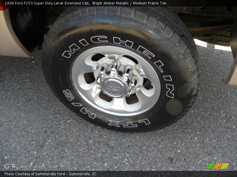 Bright Amber Metallic / Medium Prairie Tan 1999 Ford F250 Super Duty Lariat Extended Cab