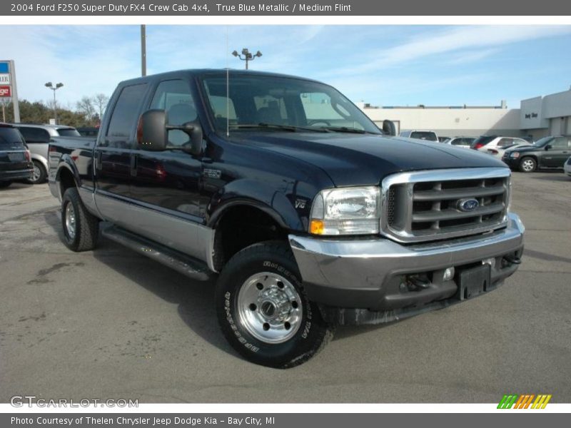 Front 3/4 View of 2004 F250 Super Duty FX4 Crew Cab 4x4