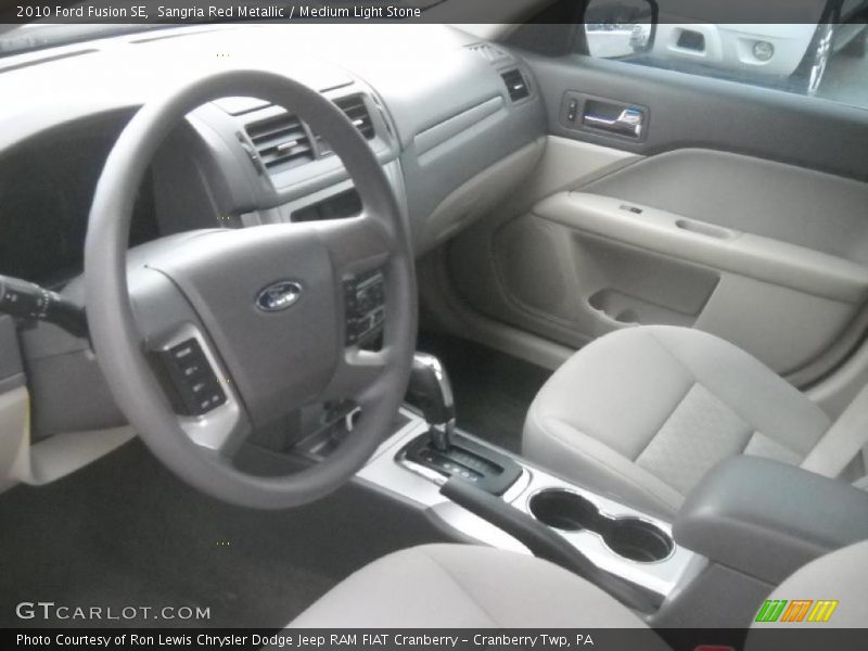 Sangria Red Metallic / Medium Light Stone 2010 Ford Fusion SE