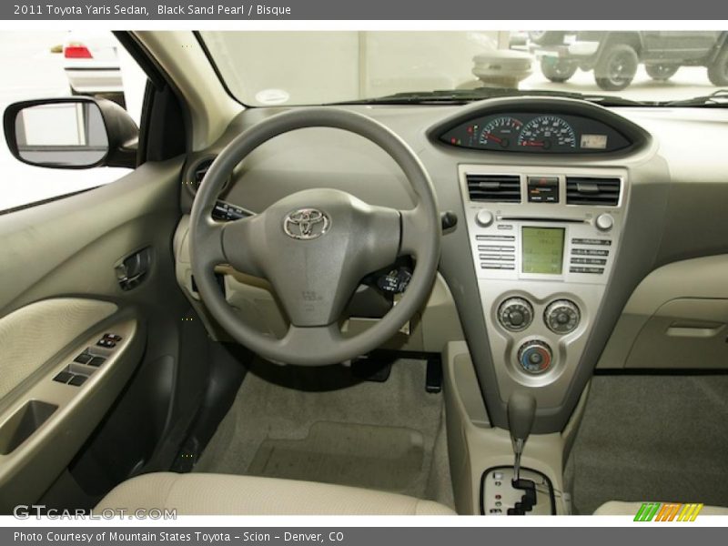 Black Sand Pearl / Bisque 2011 Toyota Yaris Sedan