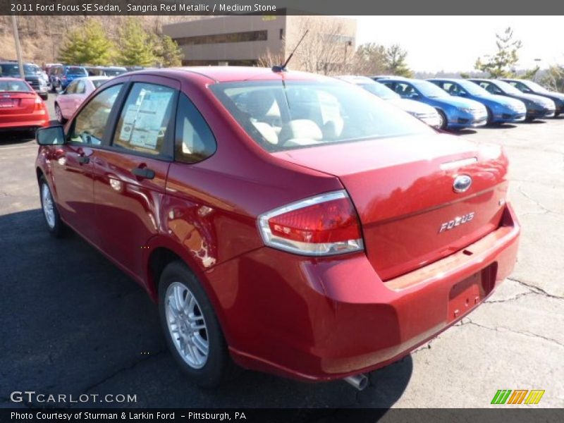 Sangria Red Metallic / Medium Stone 2011 Ford Focus SE Sedan