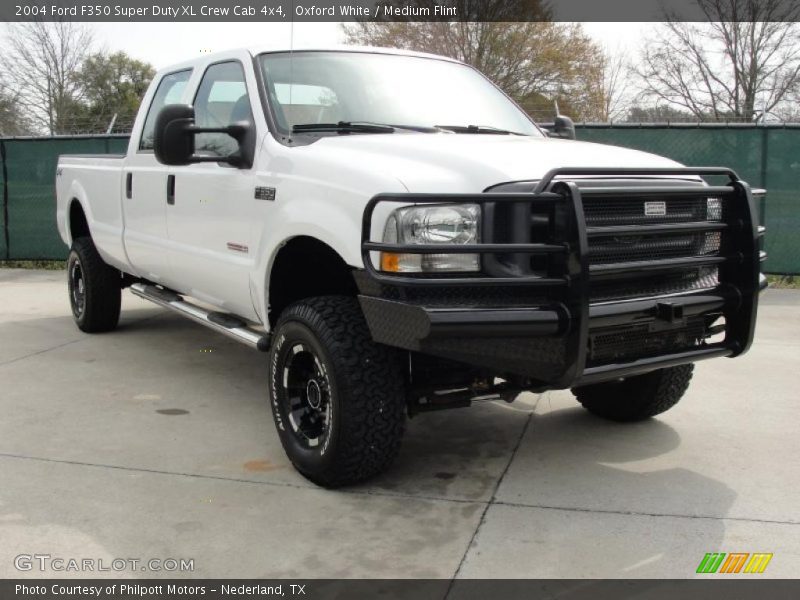 Front 3/4 View of 2004 F350 Super Duty XL Crew Cab 4x4