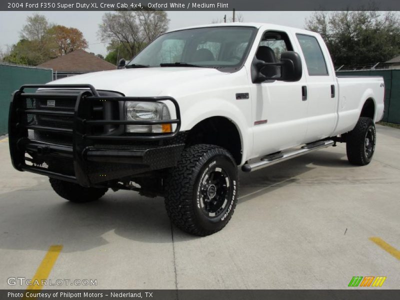 Front 3/4 View of 2004 F350 Super Duty XL Crew Cab 4x4