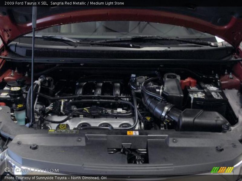 Sangria Red Metallic / Medium Light Stone 2009 Ford Taurus X SEL