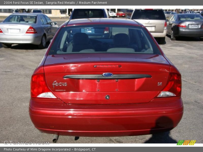 Sangria Red Metallic / Medium Parchment 2004 Ford Focus SE Sedan