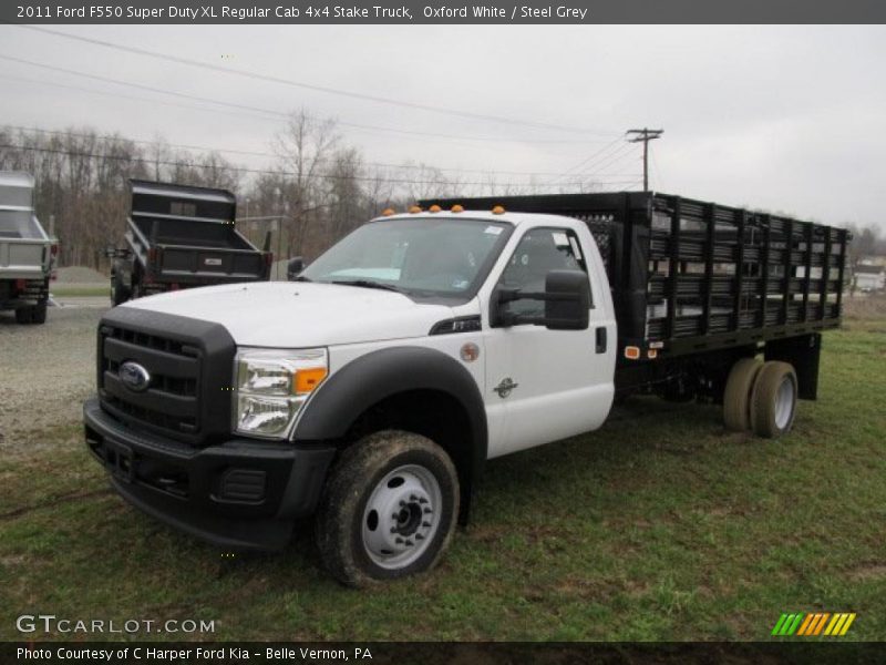 Front 3/4 View of 2011 F550 Super Duty XL Regular Cab 4x4 Stake Truck