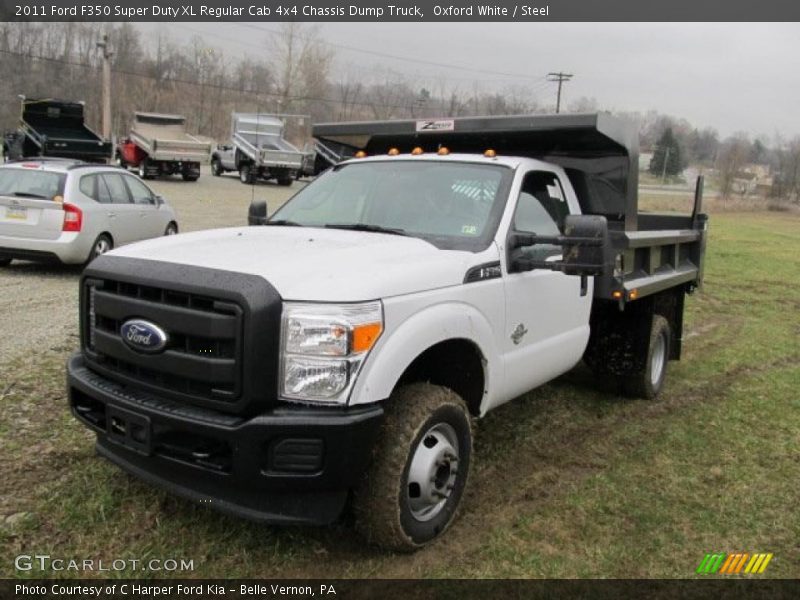Front 3/4 View of 2011 F350 Super Duty XL Regular Cab 4x4 Chassis Dump Truck