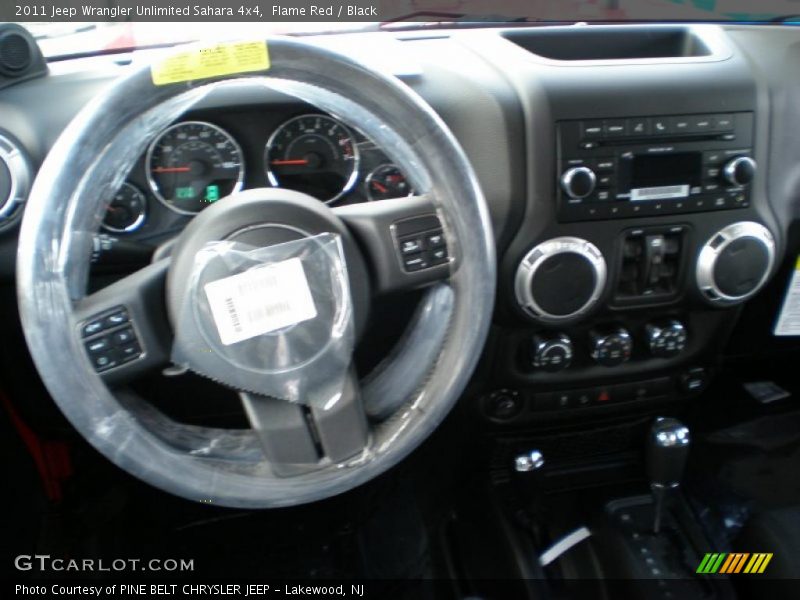 Flame Red / Black 2011 Jeep Wrangler Unlimited Sahara 4x4