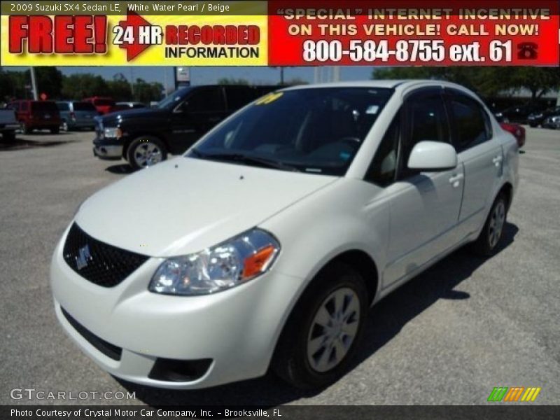 White Water Pearl / Beige 2009 Suzuki SX4 Sedan LE