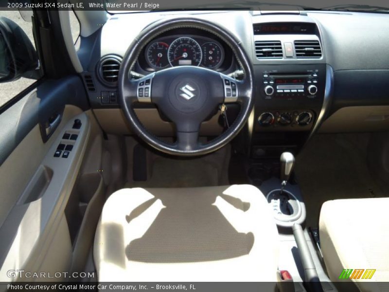 White Water Pearl / Beige 2009 Suzuki SX4 Sedan LE