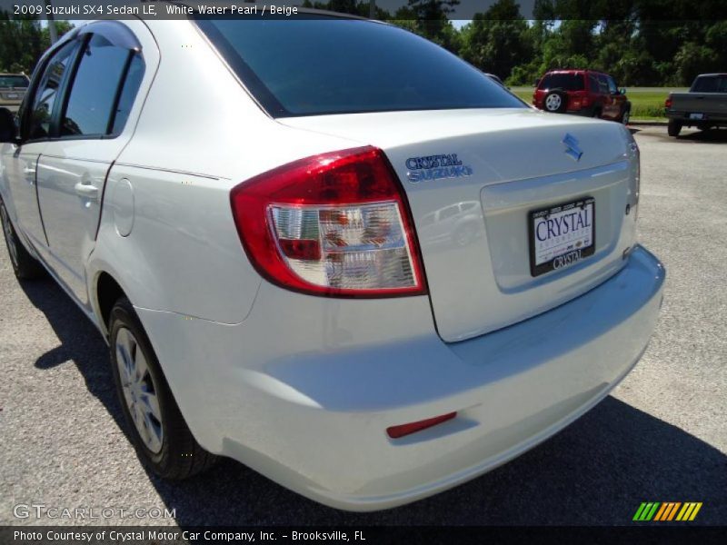 White Water Pearl / Beige 2009 Suzuki SX4 Sedan LE