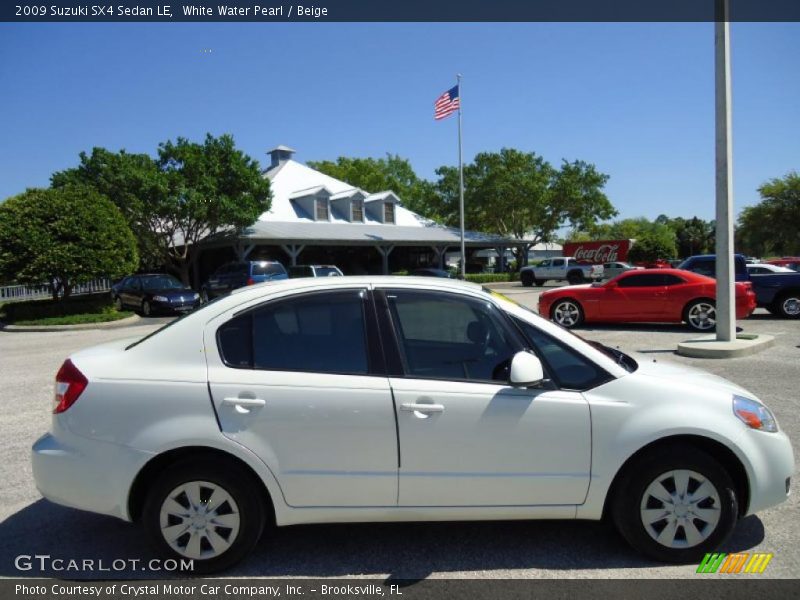 White Water Pearl / Beige 2009 Suzuki SX4 Sedan LE
