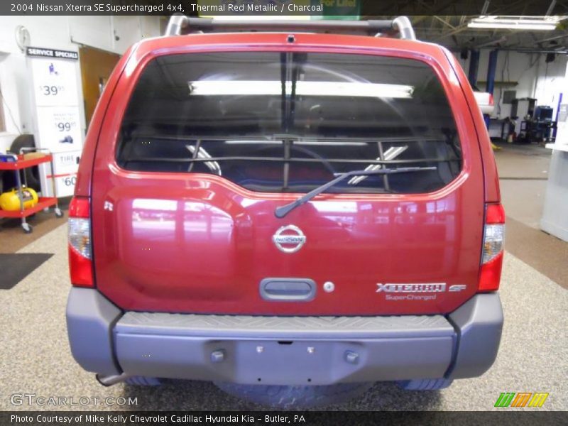 Thermal Red Metallic / Charcoal 2004 Nissan Xterra SE Supercharged 4x4