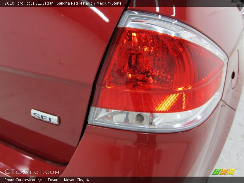 Sangria Red Metallic / Medium Stone 2010 Ford Focus SEL Sedan