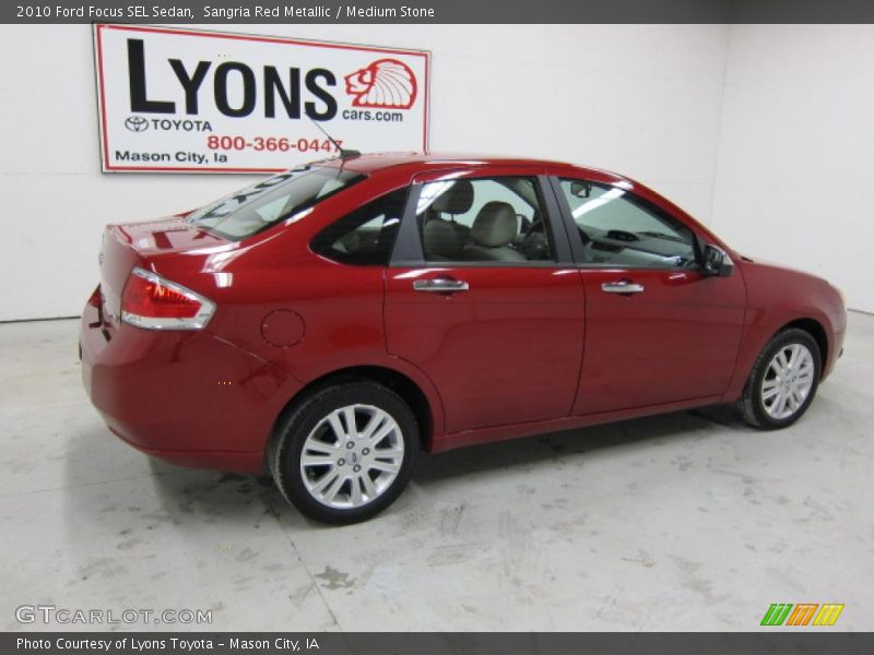 Sangria Red Metallic / Medium Stone 2010 Ford Focus SEL Sedan