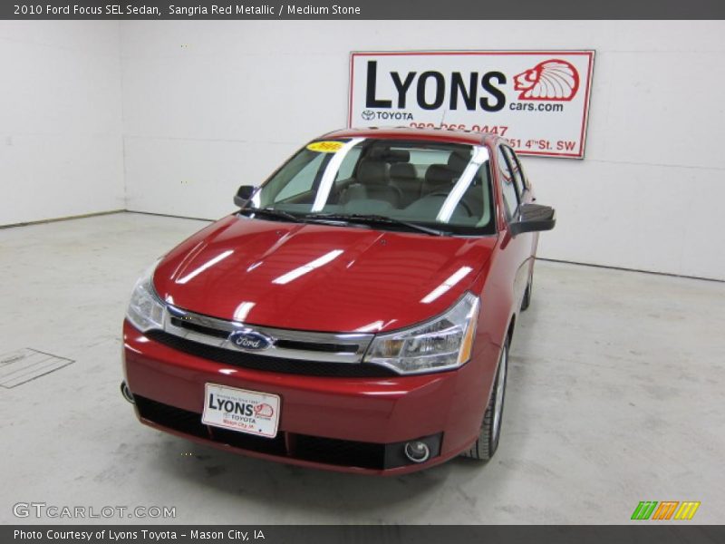 Sangria Red Metallic / Medium Stone 2010 Ford Focus SEL Sedan