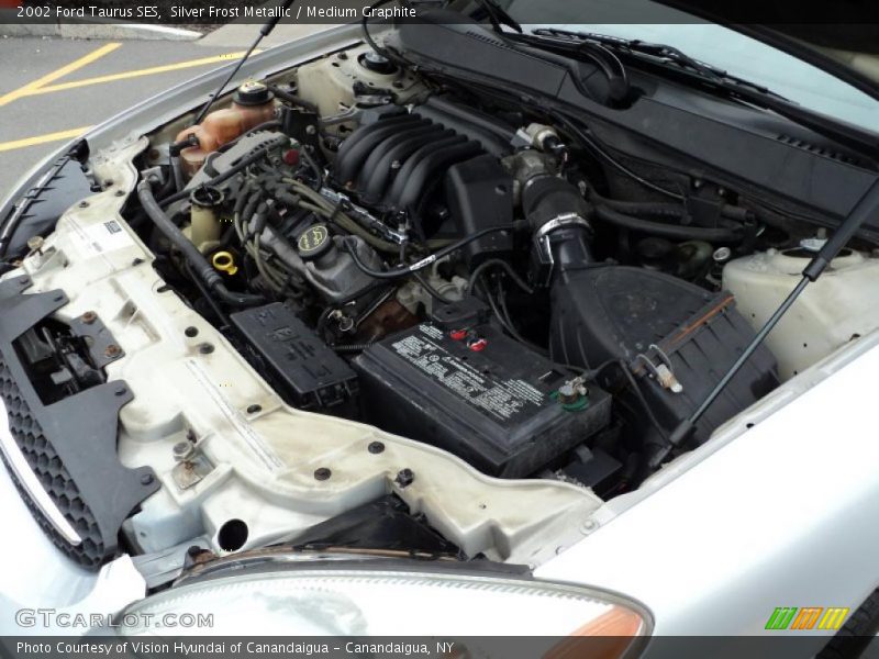 Silver Frost Metallic / Medium Graphite 2002 Ford Taurus SES