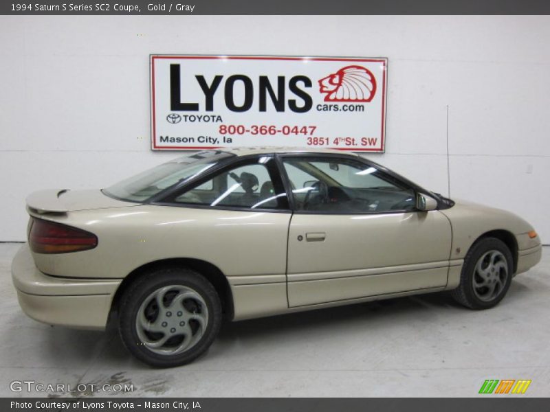 Gold / Gray 1994 Saturn S Series SC2 Coupe