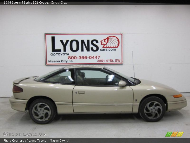 Gold / Gray 1994 Saturn S Series SC2 Coupe