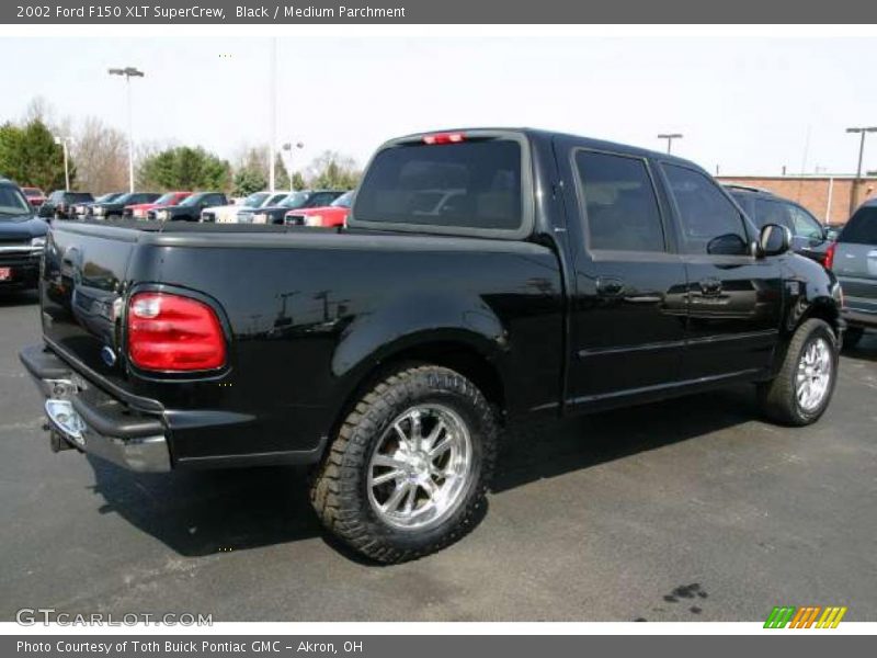 Black / Medium Parchment 2002 Ford F150 XLT SuperCrew