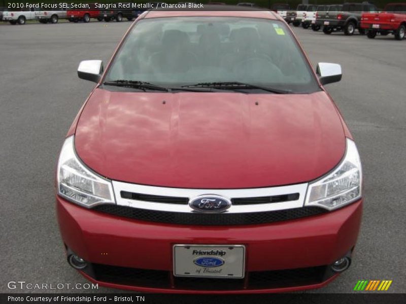 Sangria Red Metallic / Charcoal Black 2010 Ford Focus SEL Sedan