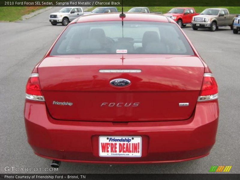 Sangria Red Metallic / Charcoal Black 2010 Ford Focus SEL Sedan