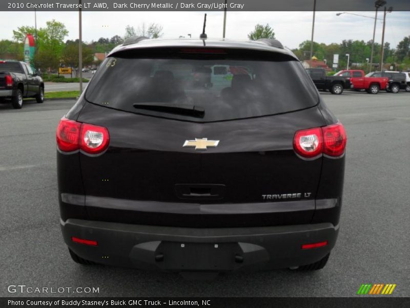 Dark Cherry Metallic / Dark Gray/Light Gray 2010 Chevrolet Traverse LT AWD