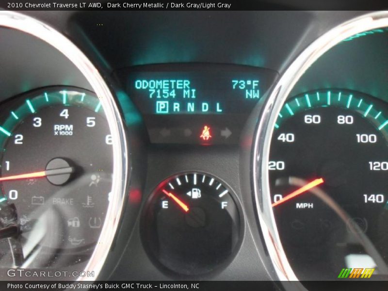 Dark Cherry Metallic / Dark Gray/Light Gray 2010 Chevrolet Traverse LT AWD