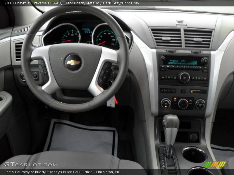 Dark Cherry Metallic / Dark Gray/Light Gray 2010 Chevrolet Traverse LT AWD